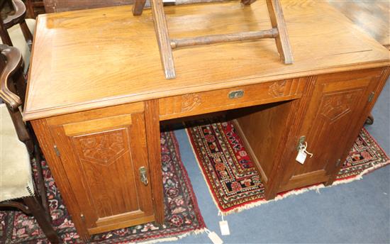 An Art Deco oak pedestal desk W.130cm